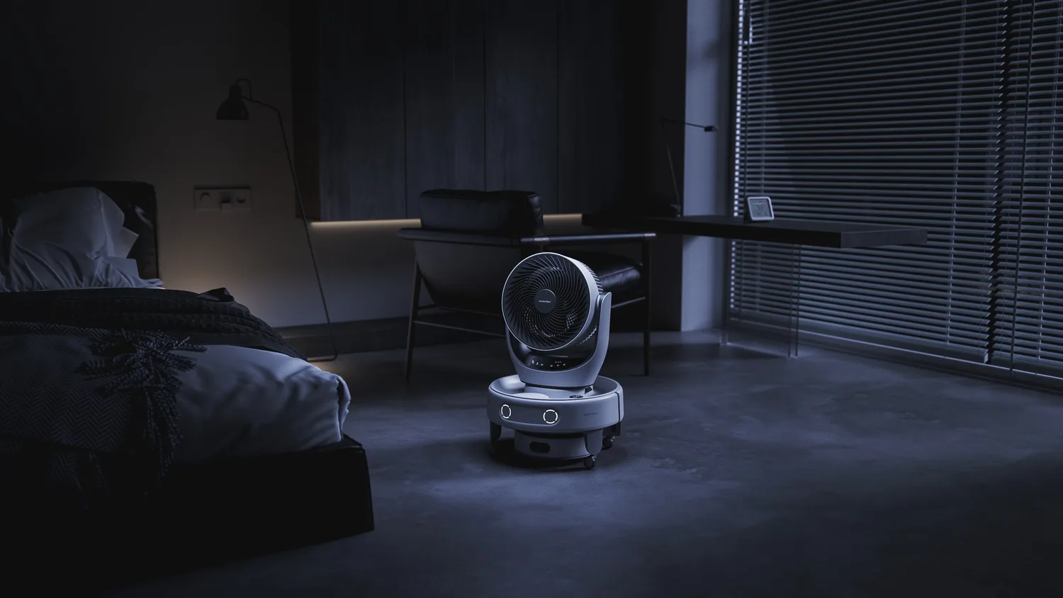 a robot vacuum cleaner with a basket of clothes on top